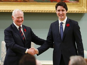 Justin Trudeau is greeted by Governor General David Johnston before being sworn-in as Canada's 23rd prime minister during a ceremony at Rideau Hall in Ottawa November 4, 2015. REUTERS/Blair Gable
