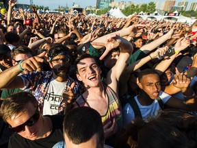 Fans of Chance The Rapper as he performs on the Bell Stage at Bluesfest in Ottawa, Ont. on Friday July 10, 2015. Errol McGihon/Ottawa Sun/Postmedia Network
