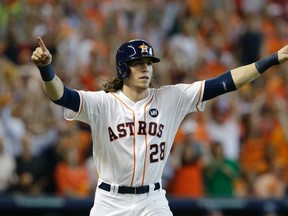 Astros outfielder Colby Rasmus celebrates after hitting a solo home run against the Royals during Game 4 of the AL Division Series in Houston on Oct. 12, 2015. (Pat Sullivan/AP Photo)