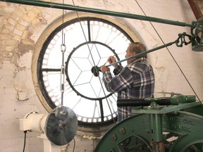 Ross Clee, the man who fixed the clock in the tower, finishing up the last details before the clock went off after more than 30 years. JONATHAN JUHA/STRATHROY AGE DISPATCH/POSTMEDIA NETWORK