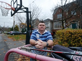 Mark Ashcroft lives in Ward 16 and has received infraction notices for having a hockey net and basketball hoop along his street which has no sidewalks. (Michael Peake/Toronto Sun/Postmedia)