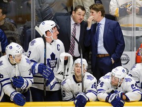 Toronto Maple Leafs head coach Mike Babcock (right) talks with assistant coach D. J. Smith during the shootout of his team's game against the Nashville Predators on Nov. 12, 2015, in Nashville, Tenn. The Maple Leafs won 2-1. (MARK HUMPHREY/AP)