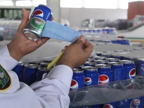 Customs officials in Saudi Arabia say cans of beer were smuggled into the kingdom disguised as Pepsi. (KsaCustoms/Twitter)