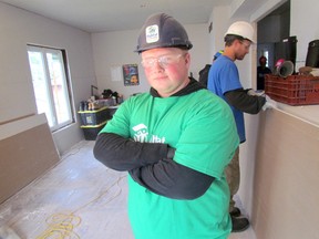 Cole Anderson, 18, a student at Sarnia Collegiate, was part of a group of volunteers from a leadership class at the Sarnia high school helping out at a Habitat for Humanity project on Friday November 13, 2015 in Sarnia, Ont. Paul Morden/Sarnia Observer/Postmedia Network