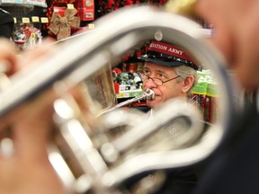 TIM MILLER/THE INTELLIGENCER
Members of the Salvation Army brass band play during the kick off of the 2015 Christmas Kettle Campaign at Giant Tiger on Millennium Parkway on Friday in Belleville This year's goal for the campaign is $150,000.