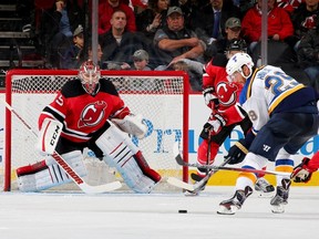 Cory Schneider of the New Jersey Devils defends his net as Martin Havlat of the St. Louis Blues lines up his shot in the second period at the Prudential Center in Newark on Nov. 10, 2015. (Elsa/Getty Images/AFP)