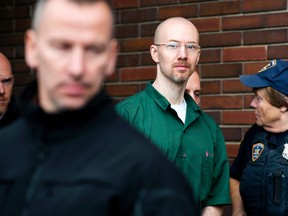 David Sweat is lead out of the Clinton County Government Center under heavy guard following his court appearance in which he pleaded guilty to one count of promoting prison contraband and two counts of escape in the first degree in Plattsburgh, N.Y. Friday, Nov. 13, 2015. (Gabe Dickens/Press-Republican via AP, Pool)