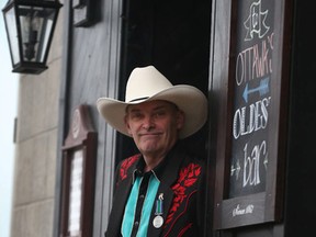 Ottawa performer Lucky Ron Burke stands outside the Chateau LaFayette on Thursday Nov 12, 2015. Ron has been performing Saturdays at the LaFayette for almost 20 years. He was awarded the Order of Ottawa on Thursday, Nov. 12, 2015.
Tony Caldwell/Ottawa Sun