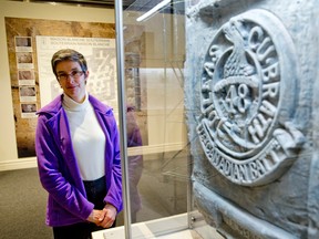 Museum London curator Amber Lloydlangston stands beside a 3D printed copy of a carving by London soldier Robert McKee, who fought with the 48th Highlanders at Vimy Ridge.  The duplicated carving is one of several on display as part of the Souterraine Impressions exhibit. (Postmedia Network Files)