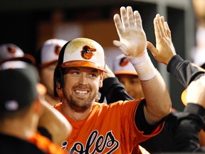 Orioles catcher Matt Wieters high-fives teammates after hitting a two-run home run against the Blue Jays in Baltimore on Sept. 30, 2015. Wieters has accepted the Orioles' $15.8 million qualifying offer on Friday, Nov. 13, 2015. (Patrick Semansky/AP Photo/Files)