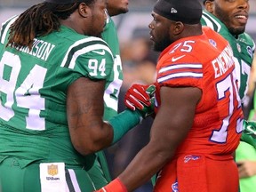 New York Jets defensive tackle Damon Harrison shakes hands with Buffalo Bills linebacker IK Enemkpali before the coin toss at MetLife Stadium in East Rutherford on Nov. 12, 2015. (Brad Penner/USA TODAY Sports)