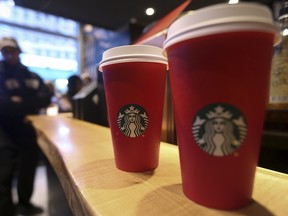 Starbucks holiday cups are pictured on a counter at a Times Square Starbucks in the Manhattan borough of New York on November 11, 2015. REUTERS/Carlo Allegri file photo