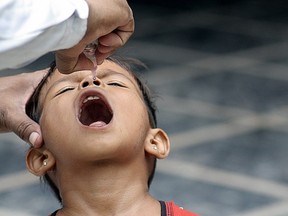 A child in Delhi, India, receives an oral polio vaccine. Ramesh Lalwani/Getty Images