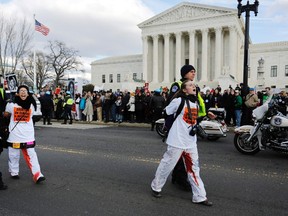 U.S. Capitol Police arrest pro-choice protesters for blocking the way of the anti-abortion March for Life at the U.S. Supreme Court building in Washington, in this file photo from January 22, 2015. (REUTERS/Jonathan Ernst/Files)