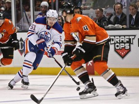 Anton Lander carries the puck up the ice against the Ducks on Wednesday. (AP Photo)
