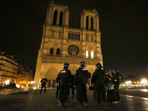 Police patrol near Notre Dame Cathedral following a series of deadly attacks in  Paris , November 14, 2015.      REUTERS/Gonazlo Fuentes