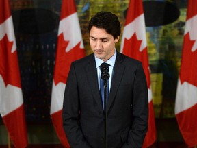 Canadian Prime Minister Justin Trudeau pauses as he addresses the media on the terrorist attacks in Paris prior to his departure for the G20 and APEC summits from Ottawa, Friday November 13, 2015. Trudeau says Canada has offered all the support it can to France following Friday's attacks in Paris. THE CANADIAN PRESS/Sean Kilpatrick
