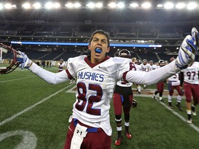 Sturgeon Heights Huskies Dryden Lavoie fires up the crowd after his team won the WHSFL AA championship game over the Steinbach Sabres on Friday. (Kevin King/Winnipeg Sun)