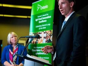 Jeff Van Roboys, of TVF Farms Inc., receives an award Friday at the Agri-Foods Innovations Awards held at Western Fair District in London. (MIKE HENSEN, The London Free Press)