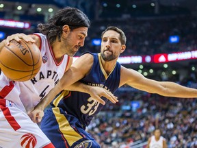 Raptors power forward Luis Scola, driving past Pelicans’ Ryan Anderson last night at the Air Canada Centre, is relying more on his three-point shot as a seasoned NBA veteran to compensate for declining athleticism. (ERNEST DOROSZUK, Toronto Sun)