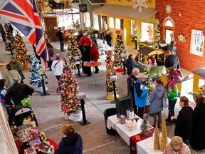 Visitors pass through Heritage Village during the 2013 edition of Christmas at Farmtown Park in Stirling. The event returns Friday through Sunday.