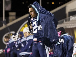 Toronto Argonauts' Chad Owens puts his jacket on on the sidelines as his team plays the Montreal Alouettes during a game at Tim Hortons Field in Hamilton on Oct. 23, 2015. (REUTERS/Mark Blinch)