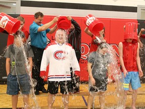 A bucket challenge was held at Ecole secondaire catholique Champlain in Chelmsford on Thursday. John Lappa/Sudbury Star/Postmedia Network