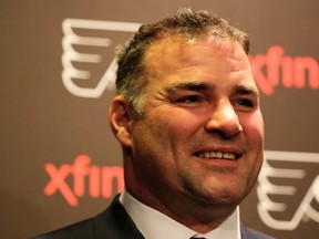 Ex-Philadelphia Flyers player Eric Lindros answers questions during a press conference before a game between the Flyers and Minnesota Wild at Wells Fargo Center in Philadelphia on Nov. 20, 2014. (Elsa/Getty Images/AFP)