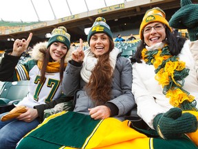 (Left to right) Esks fans Anne-Sophie Reinbold, Jessica Jacobs and Wendy Munson cheer during an Edmonton Eskimos team scrimmage at Commonwealth Stadium in Edmonton, Alta., on Saturday November 14, 2015. The Eskimos play in the Western Final on Nov. 22. Ian Kucerak/Edmonton Sun/Postmedia Network