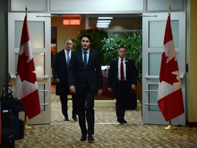 Canadian Prime Minister Justin Trudeau arrives to address the media on the terrorist attacks in Paris prior to his departure for the G20 and APEC summits from Ottawa, Friday November 13, 2015. Trudeau says Canada has offered all the support it can to France following Friday's attacks in Paris. THE CANADIAN PRESS/Sean Kilpatrick