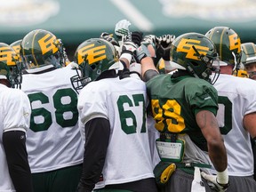 Edmonton players huddle up during Saturday's scrimmage at Commonwealth Stadium. The Eskimos host the Western final Nov. 22.