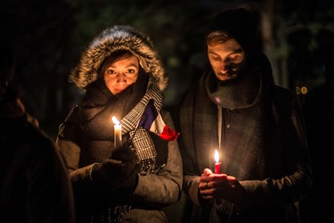 Pauline Just and Alexandre Chavand are students from France attending university in Ottawa. They were amongst many at a vigil outside of the French Embassy in Ottawa for the victims of the terrorist attack in their homeland.Saturday November 14, 2015. Errol McGihon/Ottawa Sun/Postmedia Network