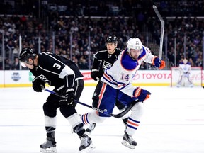 Jordan Eberle of the Edmonton Oilers collides with Brayden McNabb of the Los Angeles Kings at Staples Center on Saturday. Harry How/AFP