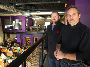 Ian Campbell of iConect, front, and Adam Carapella of Tricar show off their new offices in the former AboutTown Cab offices at Thames and Bathurst streets.  Mike Hensen/The London Free Press/Postmedia Network