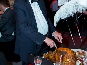 Dr. Terry Klassen, a medical director for the Children’s Hospital, carves a turkey at last year's black-tie event. (Submitted: Kelly Morton Photography)
