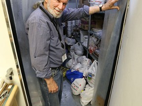 Dan Maxson, director of operations at Siloam Mission, displays supplies for an annual sit-down thanksgiving dinner. The mission now plans to entertain the less fortunate as well. (Winnipeg Sun/Postmedia Network files)