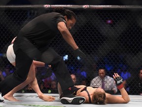 Ronda Rousey (red gloves) competes against Holly Holm (blue gloves) during UFC 193 at Etihad Stadium in Melbourne, Australia, on Nov. 15, 2015. (Matt Roberts/USA TODAY Sports)