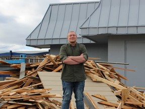 Stuart Manchee, owner of Rustic, stands outside the Sarnia bar near a pile of wood as the facility is currently closed for a 10-day renovation project. It will reopen Friday as The Station Music Hall with a new emphasis on live shows. (Terry Bridge, Sarnia Observer)