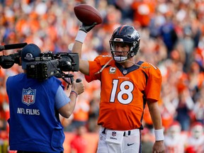 Denver Broncos quarterback Peyton Manning celebrates his new passing record in a game against the Kansas City Chiefs in Denver on Nov. 15, 2015. (AP Photo/Jack Dempsey)