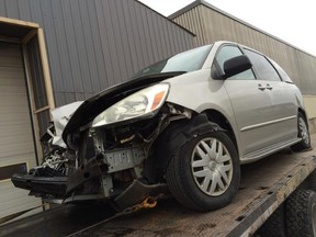 Ted Currier?s van was totalled after it was struck by a flying truck tire on Highway 401 near Woodstock. Nobody was injured. (Special to Postmedia Network)