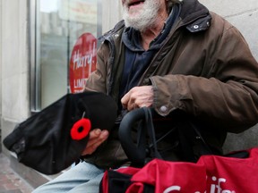 Even though the city has spent millions trying to address the problem, panhandling flourishes in downtown Toronto. (VERONICA HENRI, Toronto Sun)