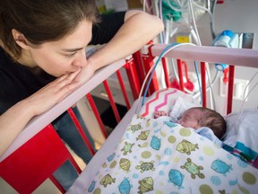 Patricia Croteaux, 38, with her 10-week-old daughter Catherine who was premature by. Catherine who was born at 24 weeks, has since tripled her birth weight since being in the Ottawa Hospital's NICU. DANI-ELLE DUBE/OTTAWA SUN/POSTEDIA NETWORK)