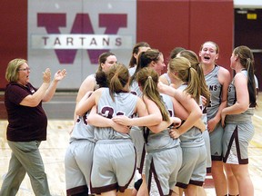 The Wallaceburg Tartans celebrate after winning the LKSSAA senior girls 'AA' basketball championship Saturday at Wallaceburg District Secondary School. (DAVID GOUGH/Postmedia Network)