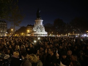 People gather at the Place de la Republique square in Paris, on Sunday, Nov. 15, 2015, two days after a series of deadly attacks. (AFP)