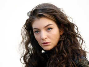 Singer Lorde poses before French fashion house Christian Dior Autumn/Winter 2015/2016 women's ready-to-wear collection show during Paris Fashion Week March 6, 2015. REUTERS/Charles Platiau