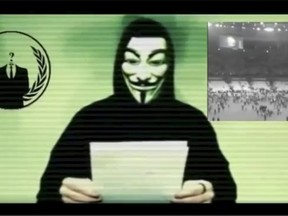 A man wearing a mask associated with Anonymous makes a statement in this still image from a video released on November 16, 2015. The Anonymous hackers collective is preparing to unleash waves of cyberattacks on Islamic State following the attacks in Paris last week that killed 129 people, it declared in the video posted online. (REUTERS/Social Media Website via Reuters )