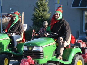 For the third straight year the Wallaceburg Knights of Pythias Santa Claus parade tried to set the Guinness World Record for the most riding lawn mowers/tractors in a Santa Claus parade on Nov. 14. Although they fell short once again, about 100 lawn tractors rode in the parade