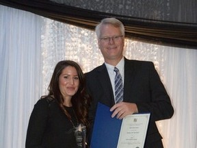 Huron Chamber of Commerce Business of the year award (Presented by Chamber president Gerry Rogers to Brianna Latimer, daughter of owner Herb Marshall): Beach Street Station. (Photo courtesy of George Zoethout)