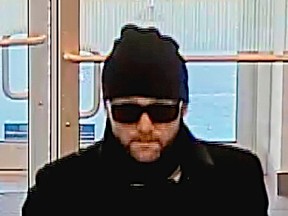 Investigators need help identifying this man, who suspect in two bank robberies, one in Thornhill last month and one in the Junction Triangle in May. (Toronto Police photo)
