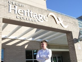 Aaron Stafford, a second-year student at CEGEP Heritage College Gatineau campus, is one of the students surprised to find out there's a new security protocol -- mandatory bag checks prior to entering school -- in place. Police swept CEGEP Heritage College's Gatineau and Pontiac campuses Monday morning after receiving the fifth email bomb threats in less than a month. (Julienne Bay, Ottawa Sun / Postmedia Network)